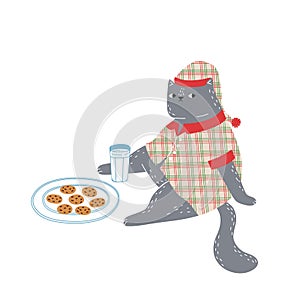 A cute fat cat dressed in pajamas and a nightcap is waiting for Santa Claus to arrive with milk and cookies. Cute