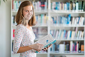 Cute female university/highschool student in library