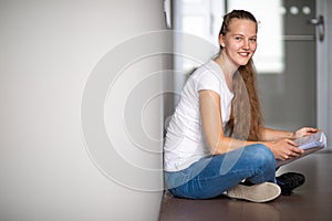 Cute female university/highschool student in library