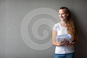 Cute female university/highschool student in front of a blackboard