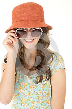 Cute female wearing orange hat and sunglasses