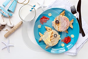 Cute fish shaped sadwiches with ham and cheese for kids