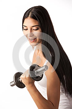 Cute fitness girl working out with dumbbells