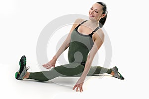 Cute fitness model holding the splits