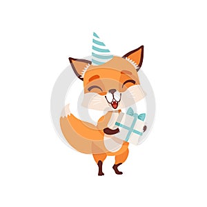 Cute fox character in party hat holding gift box, funny forest animal vector Illustration on a white background