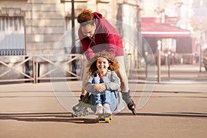 Cute friends with skateboard and skates having fun