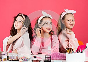 They are really cute. friendship party with cosmetic. relax and having fun. small girls in beauty salon. little sisters