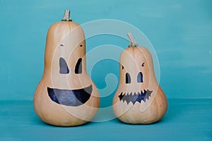 Cute funny jack o lantern pumpkin smiling faces made with butternut squash.