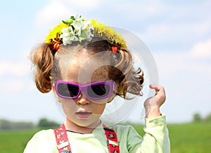 Cute funny little girl in sunglasses