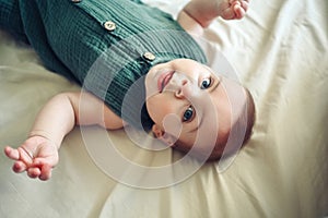 Cute funny newborn little boy peacefully sleeping on white sheets in bed or crib. Baby goods packaging template. Healthy