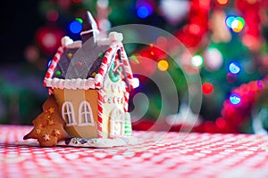 Cute gingerbread cookie and candy ginger house