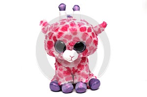 A cute giraffe soft toy with pink spots