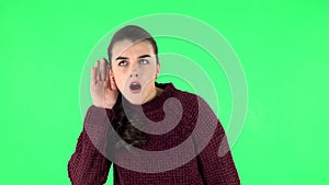 Cute girl angrily texting on her phone. Green screen