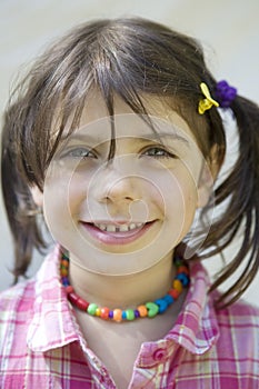 Cute girl with beads smiling