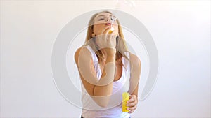 Cute girl blowing soap bubbles