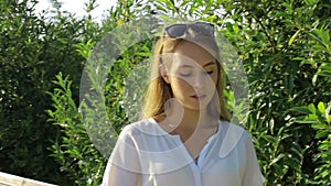 Cute girl blowing soap bubbles