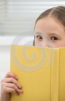 Cute girl with book.