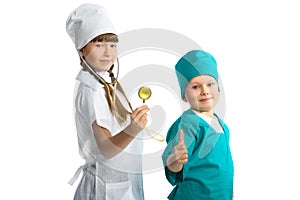 Cute girl and boy doctor in uniform standing