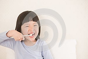 Cute girl brush teeth