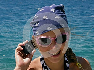 Cute girl with cellular photo