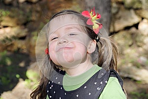 Cute girl child making a naughty facial expression