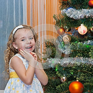 Cute girl with Christmas tree