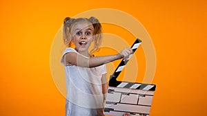 Cute girl clapping flapper dreaming to be film producer, advertisement template