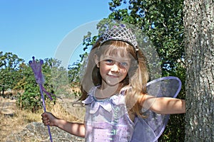 Cute girl with crown and wings