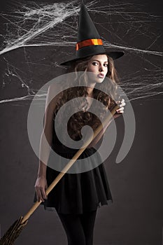 Cute girl dressed as halloween witch