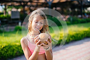 Cute Girl drinking coconut water