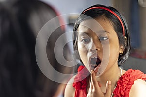 a cute girl in front of mirror