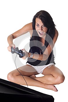 Cute girl with gamepad playing photo