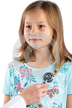 Cute girl having cardiovascular auscultation check up photo