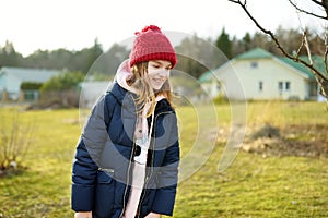 Cute girl having fun on beautiful spring day. Active family leisure with kids. Family fun outdoors
