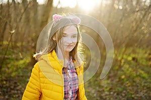 Cute girl having fun on beautiful spring day. Active family leisure with kids. Family fun outdoors