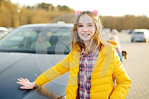 Cute girl having fun on beautiful spring day. Active family leisure with kids. Family fun outdoors