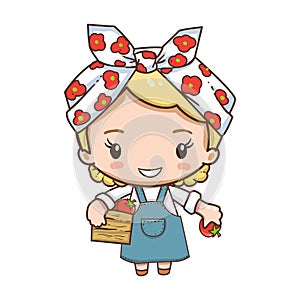 Cute girl in headscarf holding red tomato and wooden box