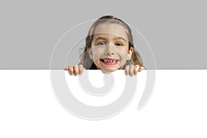 Cute girl holding a blankboard