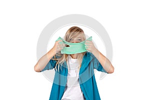 Cute girl holding green slime looks like gunk in front of her face