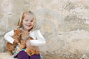 Cute girl holding kittens