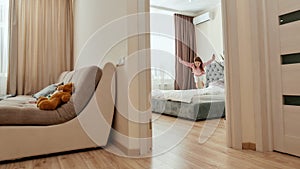 A cute girl jumping down on a big bed in a bedroom having her teddybear in a guestroom