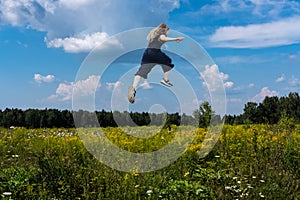 Cute girl jumping funny in clouds