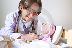 Cute girl kid playing doctor. Healtcare concept