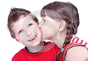 Cute girl kissing a blue eyed boy