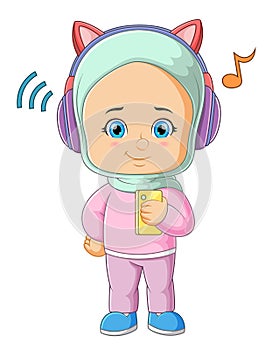 The cute girl is listening the favorite music with the headphone