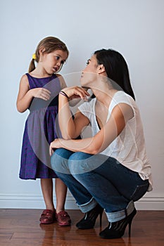 Cute girl looks at her mom with adoring eyes