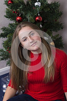 Cute girl near New Year tree