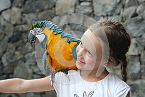 Cute girl and parrot