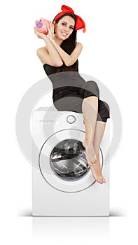 Cute Girl With Piggy Bank on a Washing machine