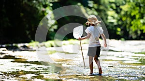 Cute girl playing in a beautiful mountain stream